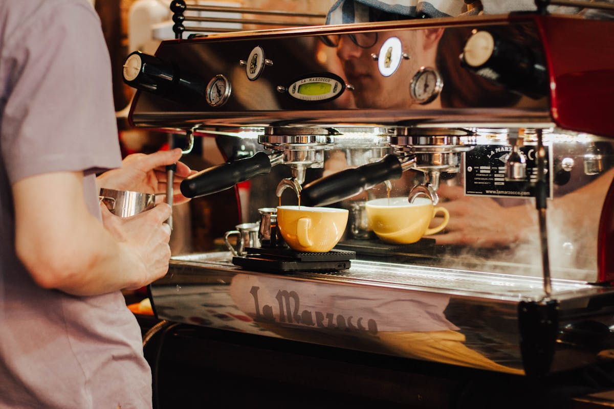 Traditional Neapolitan coffee bar with espresso machine and cups