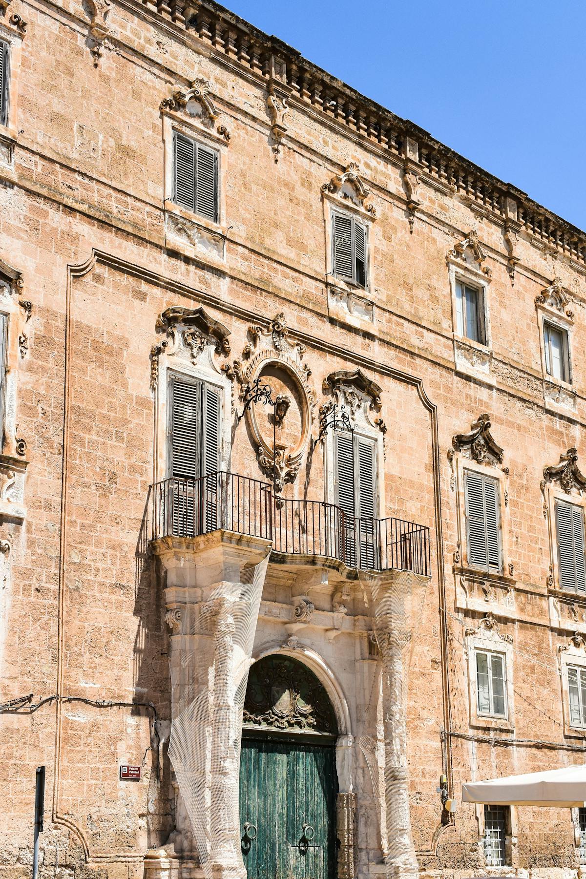 Exterior of the Cappella Sansevero on a narrow Naples street